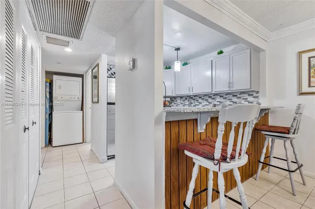a view of a kitchen with furniture and a chandelier