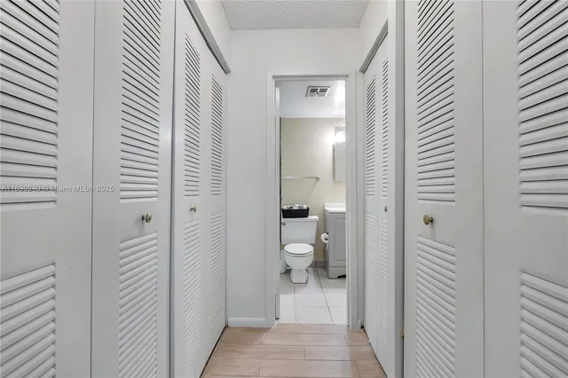 a view of a bathroom from the hallway