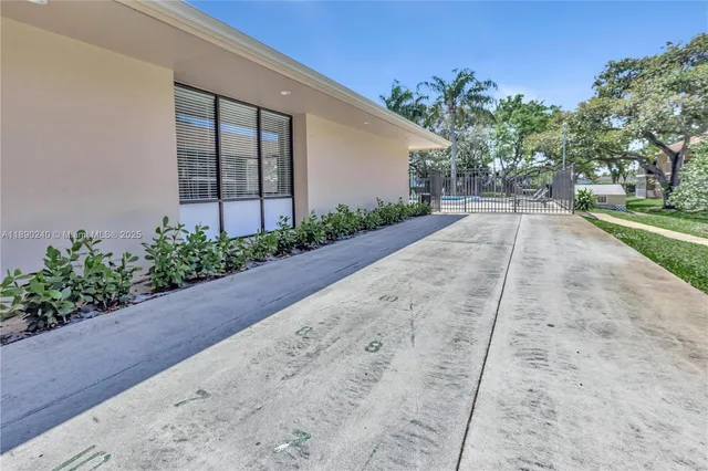 a view of a backyard of the house