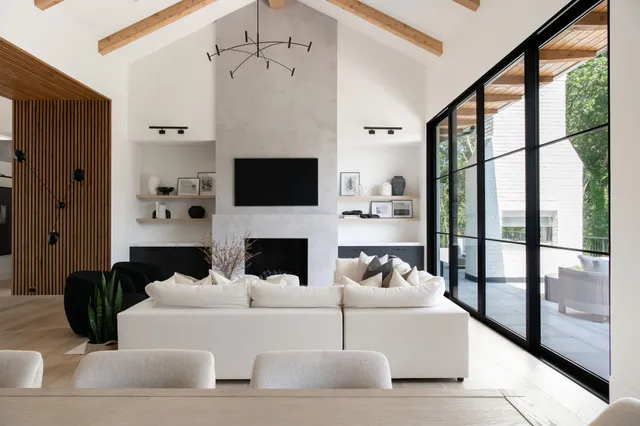 a living room with furniture fireplace and flat screen tv