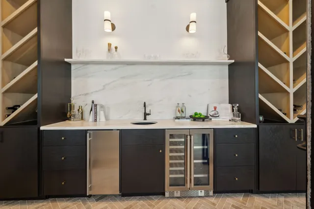 a kitchen with a sink and cabinets