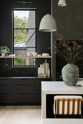 a kitchen with a sink a counter top space and a window