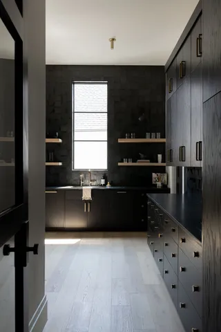 a kitchen with granite countertop a refrigerator and a stove