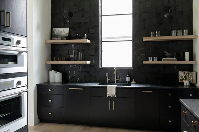 a kitchen with a sink and cabinets