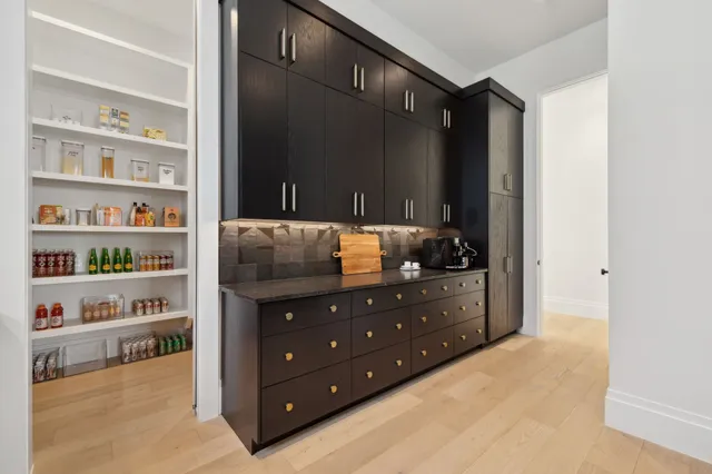 a room with a cabinet and a book shelf