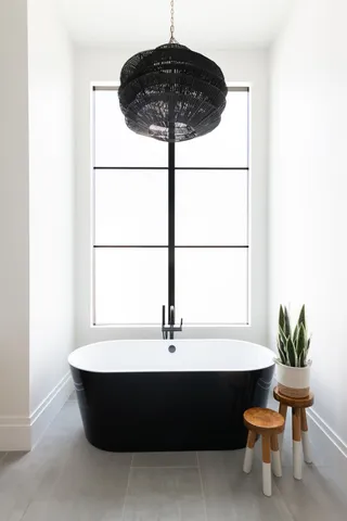 a room with a table and a potted plant