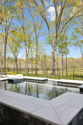 a view of a yard next to a lake