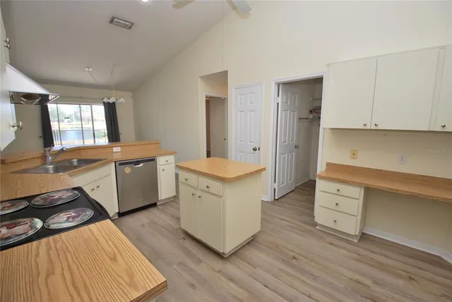 a view of a room with wooden floor