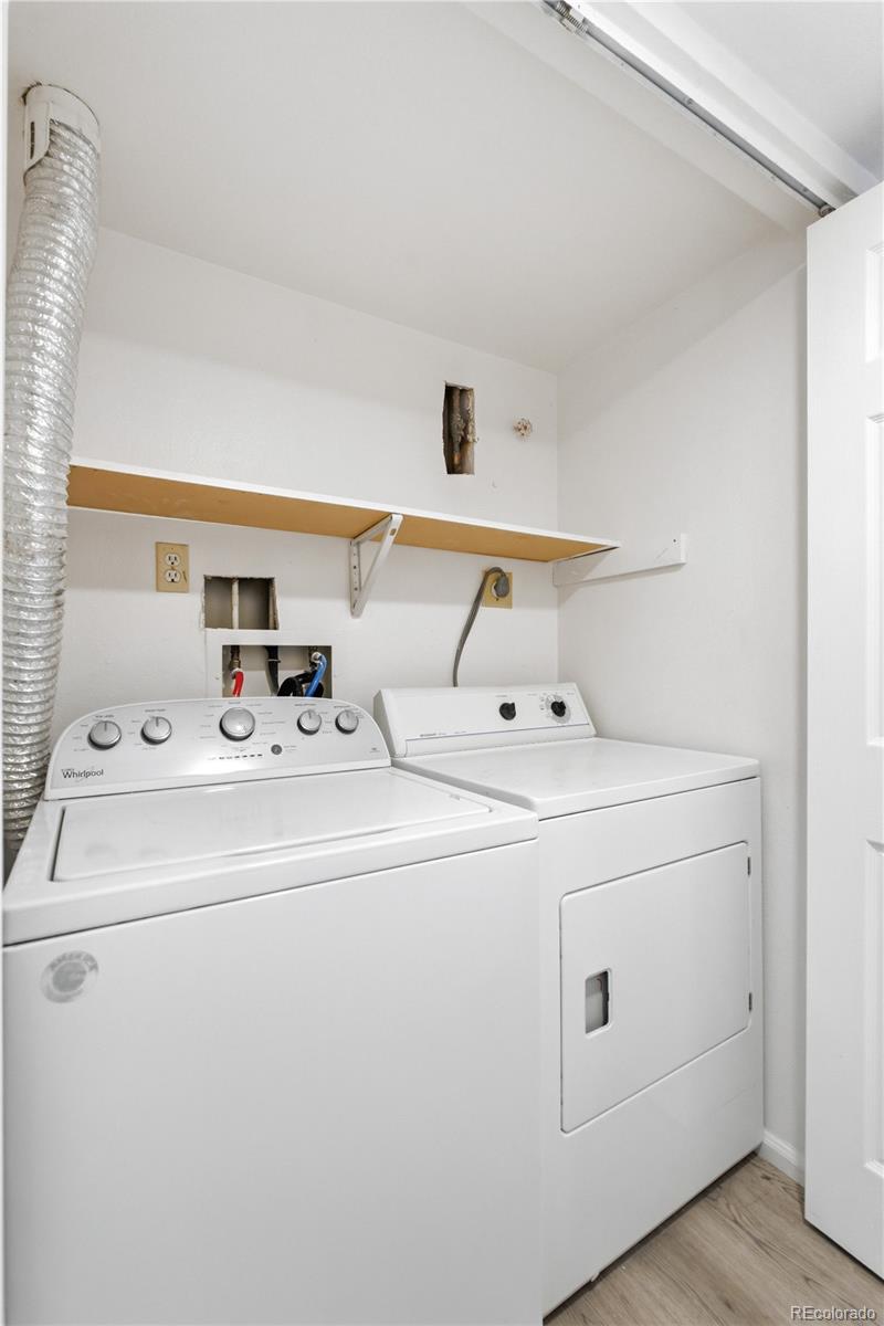 481 South Kalispell Way, Unit 306 Aurora, CO 80017 - Photo 21 of 43 a utility room with dryer and washer
