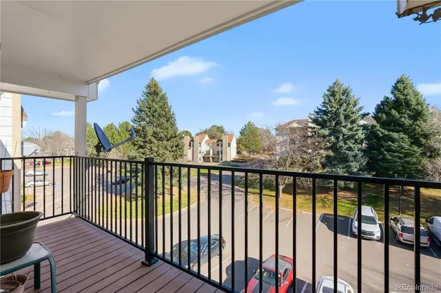 a view of a balcony with wooden floor