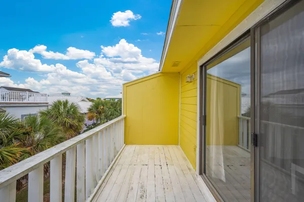 a view of balcony with wooden floor