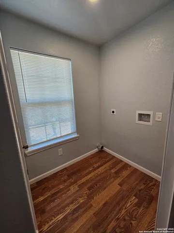 a view of room with window and hardwood floor