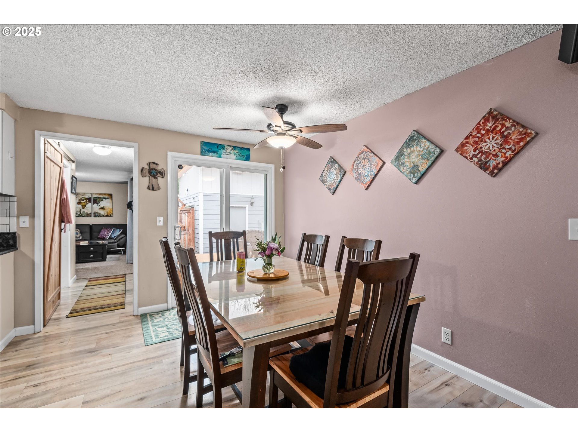 24795 Parkside Drive Veneta, OR 97487 - Photo 15 of 42 a view of a dining room with furniture and wooden floor