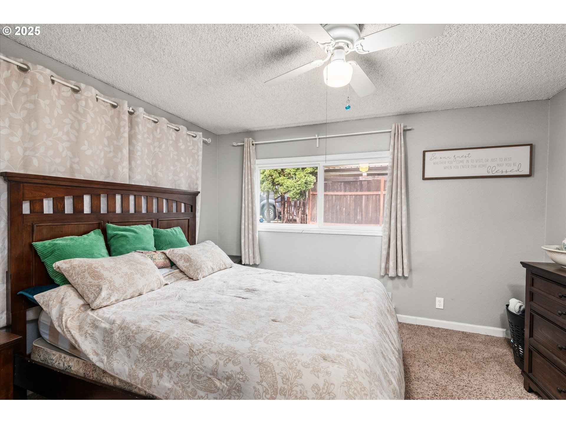 24795 Parkside Drive Veneta, OR 97487 - Photo 20 of 42 a bed sitting in a bedroom next to a window