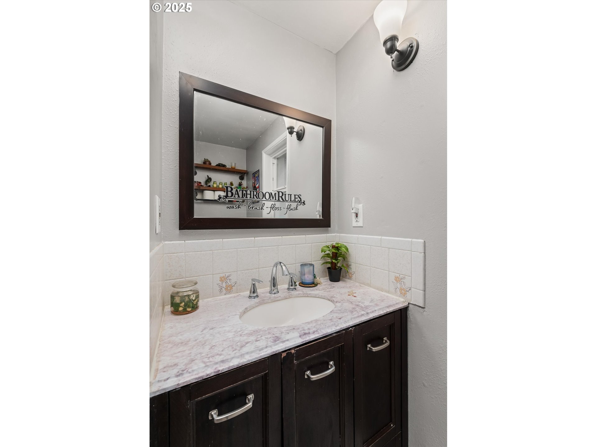24795 Parkside Drive Veneta, OR 97487 - Photo 22 of 42 a bathroom with a granite countertop sink and a mirror