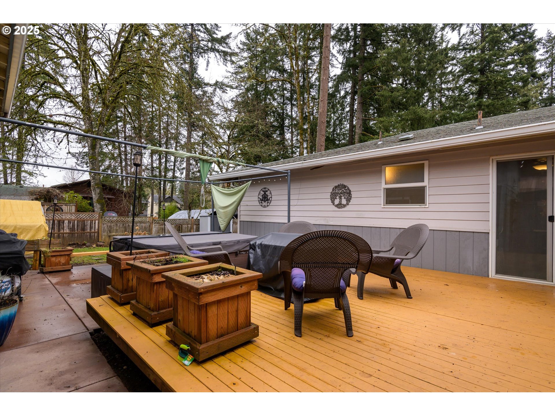 24795 Parkside Drive Veneta, OR 97487 - Photo 29 of 42 a view of a roof deck with table and chairs with wooden fence