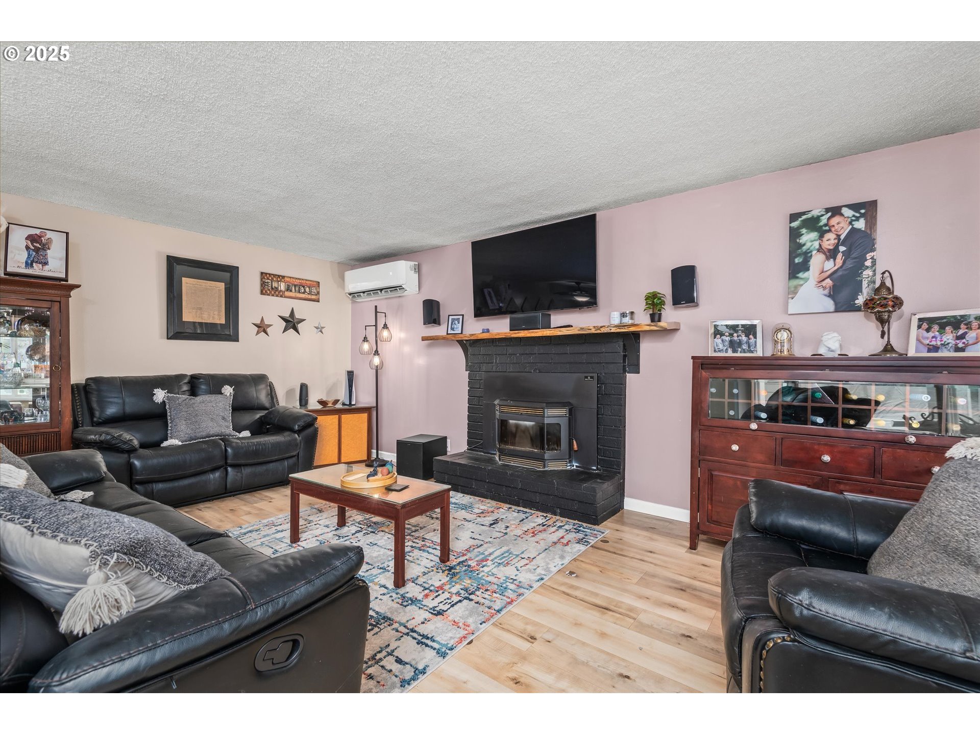 24795 Parkside Drive Veneta, OR 97487 - Photo 7 of 42 a living room with furniture a flat screen tv and a fireplace