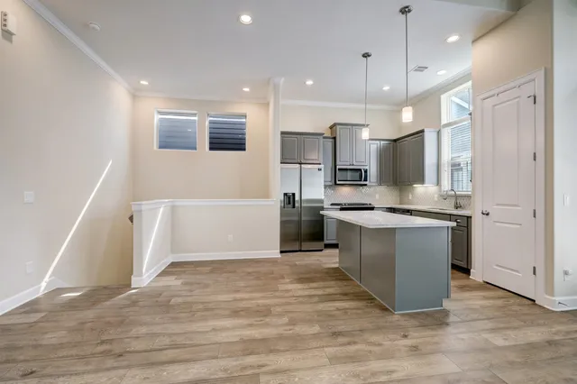 a large kitchen with a lot of counter space and a sink