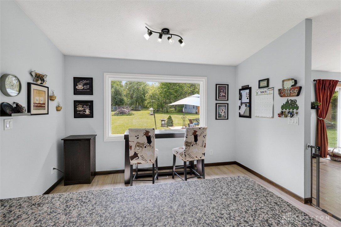 2165 Stewart Road Xenia, OH 45385 - Photo 11 of 59 This bright space features ample natural light and backyard views, perfect for a home office or dining area.