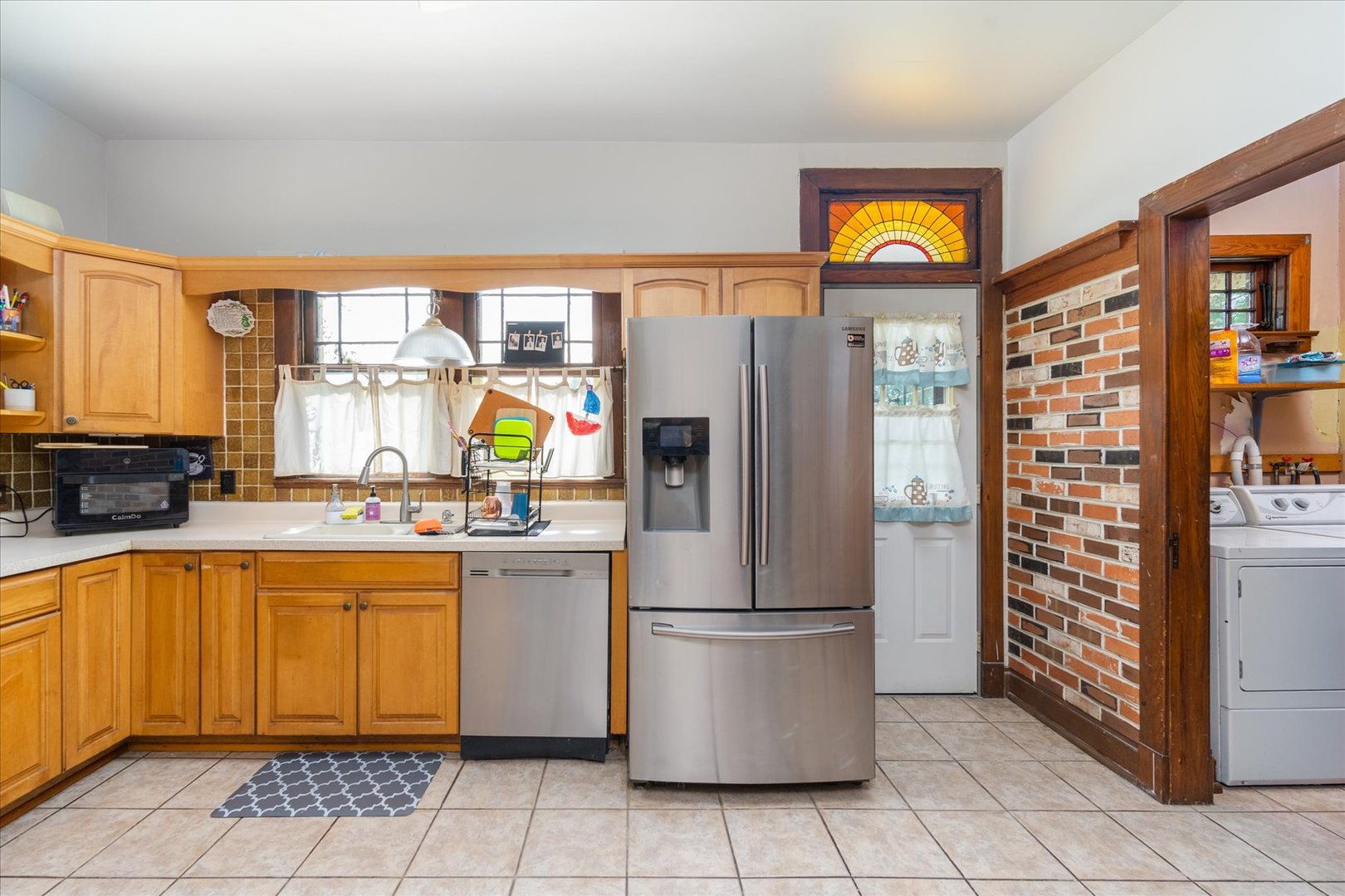532 7th Street LaSalle, IL 61301 - Photo 16 of 36 a kitchen with stainless steel appliances granite countertop a refrigerator and a sink
