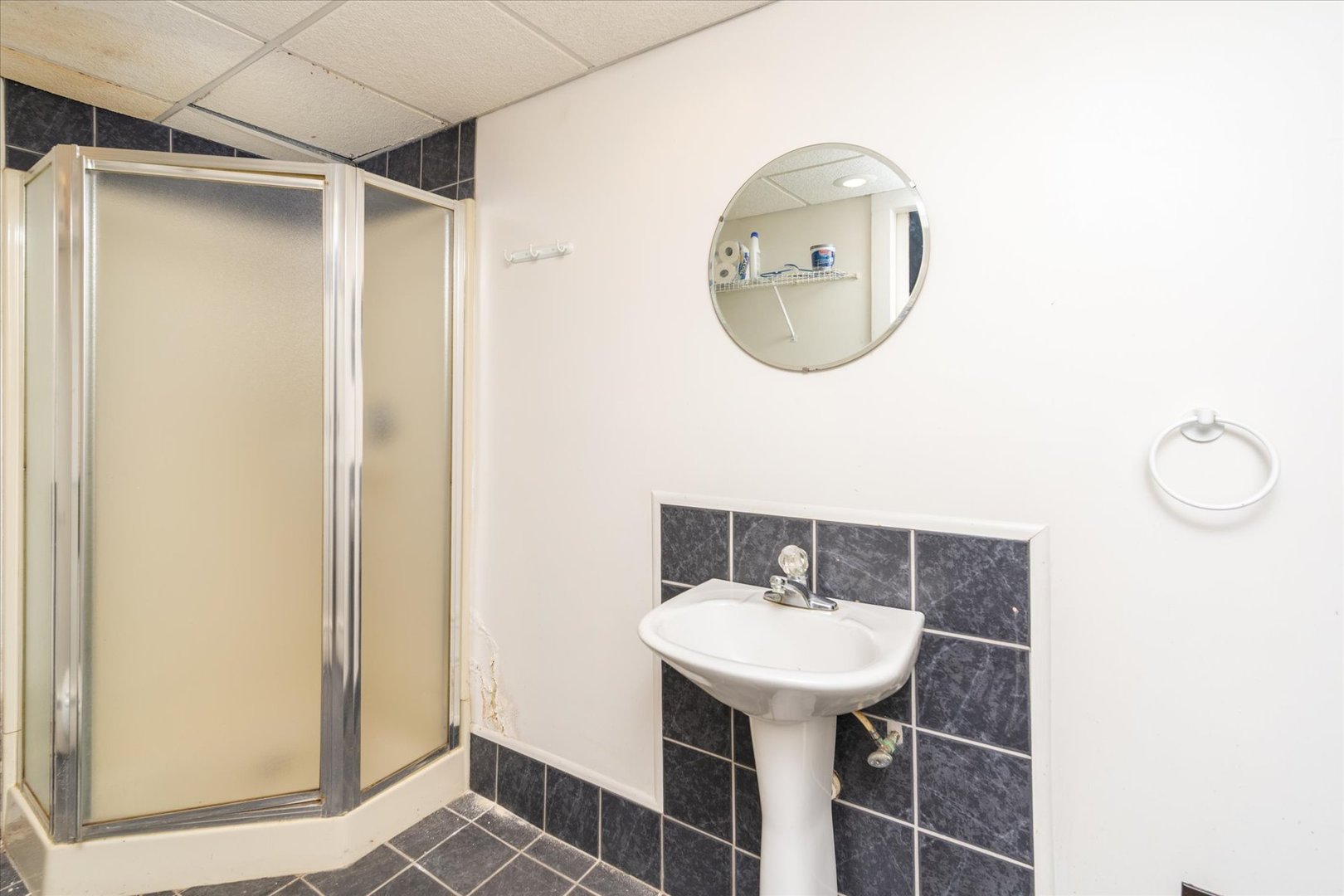 532 7th Street LaSalle, IL 61301 - Photo 28 of 36 a bathroom with a sink mirror and toilet
