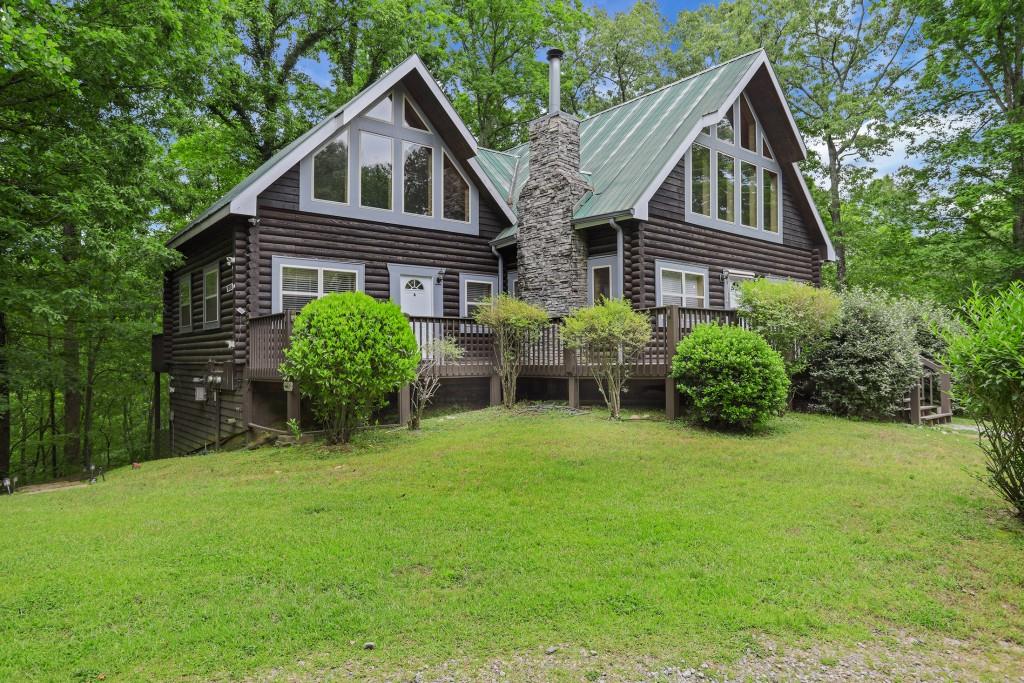 101 Yellow Bluff Road Dahlonega, GA 30533 - Photo 2 of 20 a front view of house with a garden