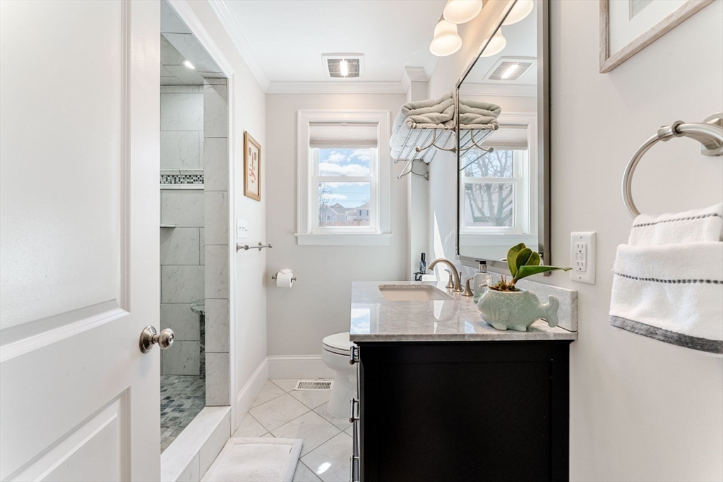 19 Damon Road Scituate, MA 02066 - Photo 11 of 33 a bathroom with a sink and a mirror