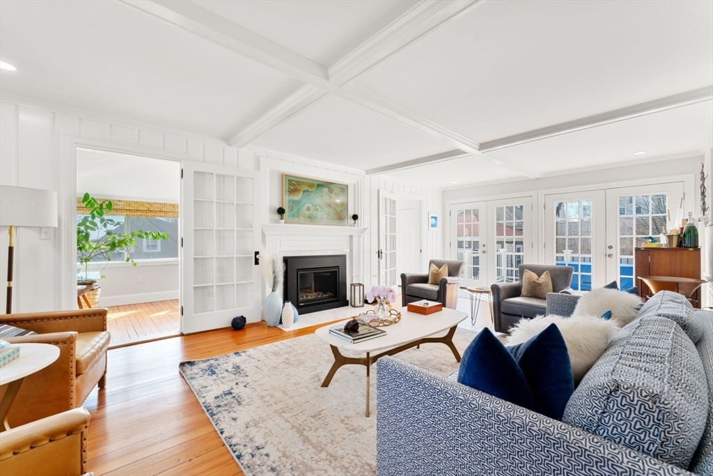 19 Damon Road Scituate, MA 02066 - Photo 12 of 33 a living room with furniture a rug and a fireplace