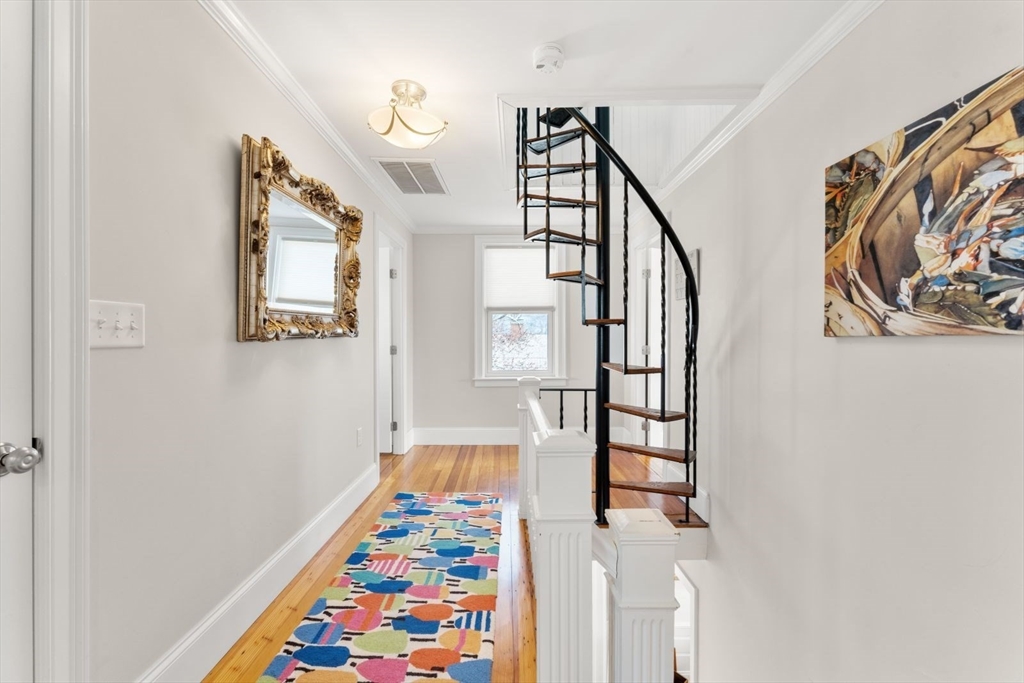 19 Damon Road Scituate, MA 02066 - Photo 16 of 33 a front view of a house with wooden floor and windows