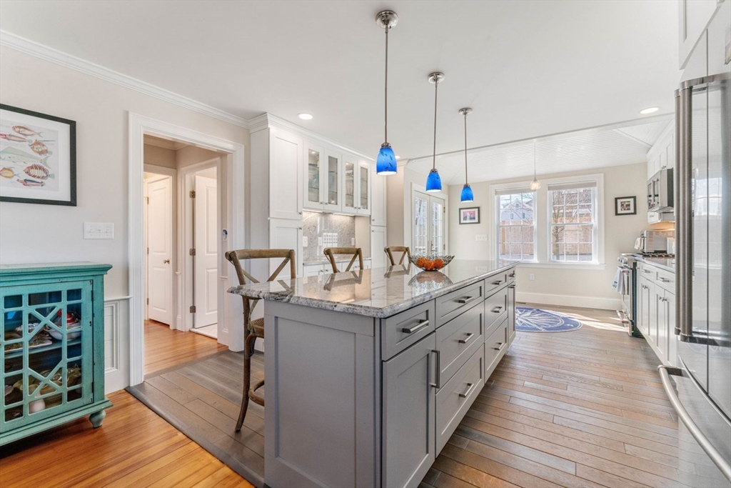 19 Damon Road Scituate, MA 02066 - Photo 8 of 33 a kitchen with stainless steel appliances granite countertop a stove and a wooden floors