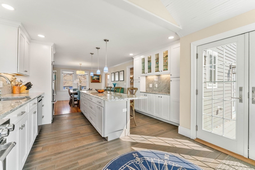 19 Damon Road Scituate, MA 02066 - Photo 9 of 33 a large white kitchen with wooden floors and stainless steel appliances