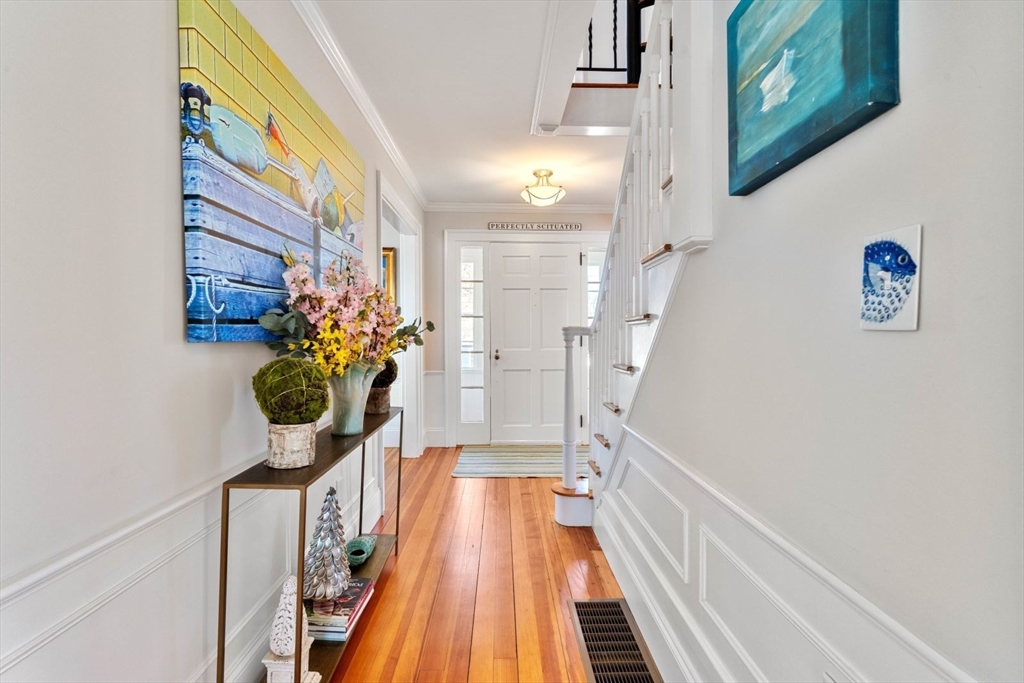 19 Damon Road Scituate, MA 02066 - Photo 10 of 33 a view of a hallway with wooden floor and a potted plant