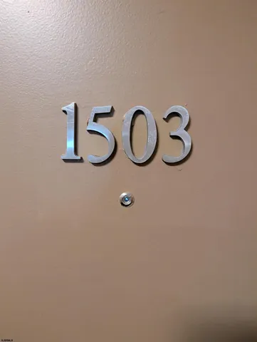 a bedroom with a bed couch and a window