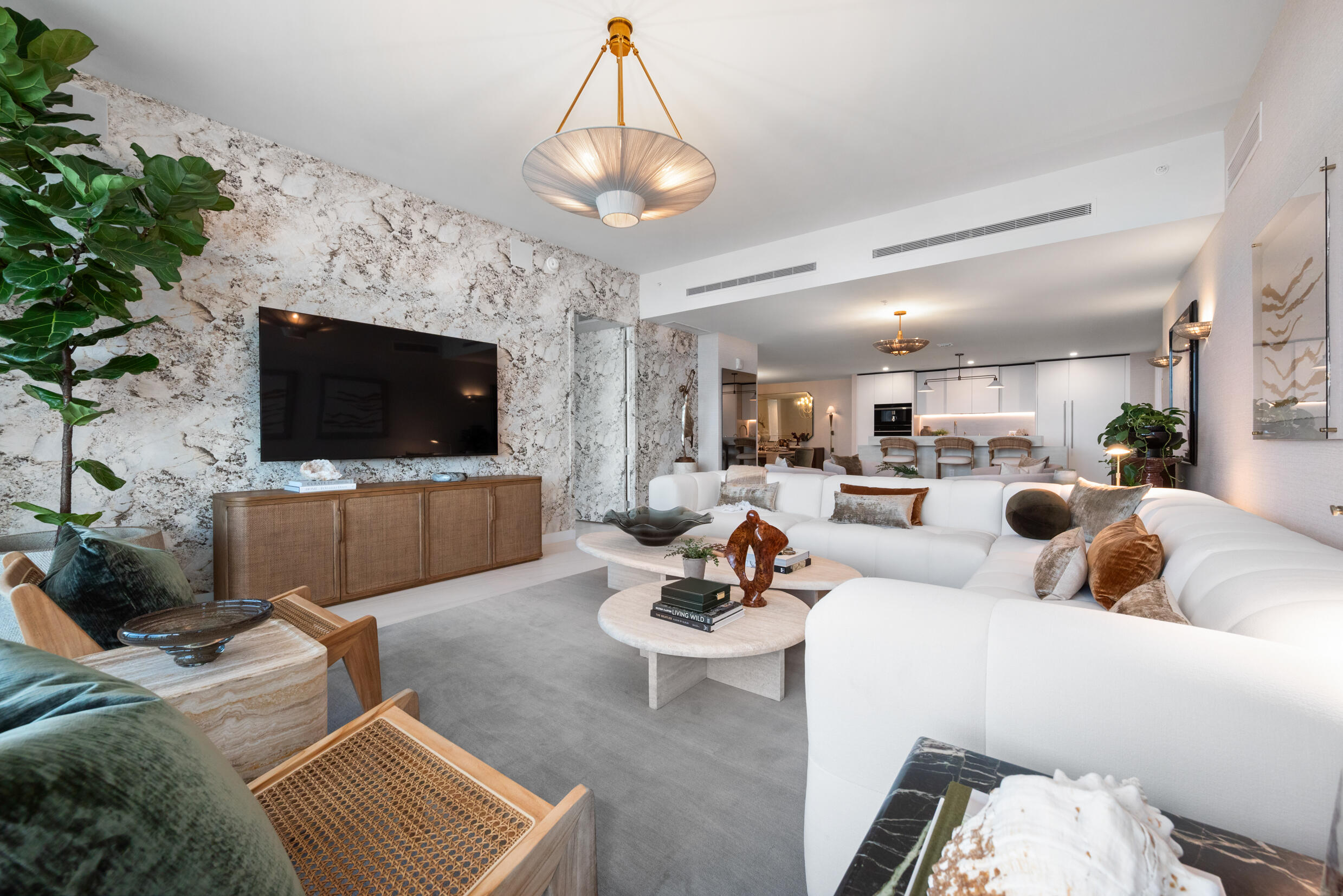 900 North Ocean Boulevard, Unit MPH02 Pompano Beach, FL 33062 - Photo 15 of 36 a living room with furniture and a flat screen tv