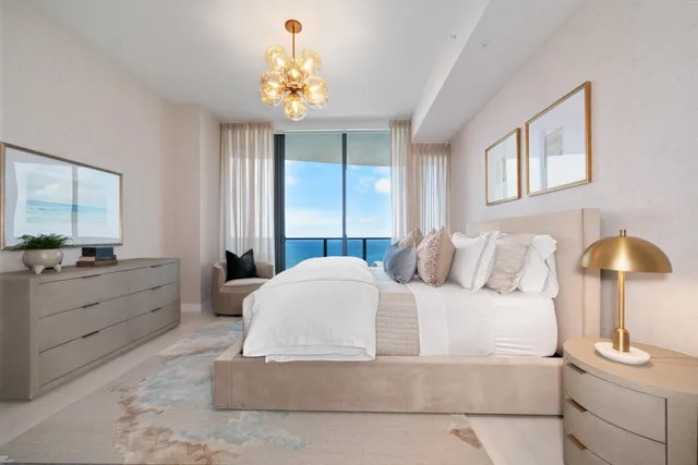 a living room with a bed furniture and a window