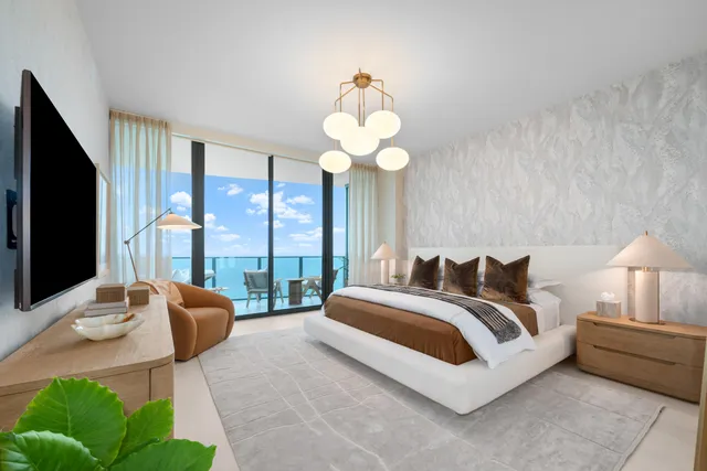 a spacious bedroom with a bed and a large window