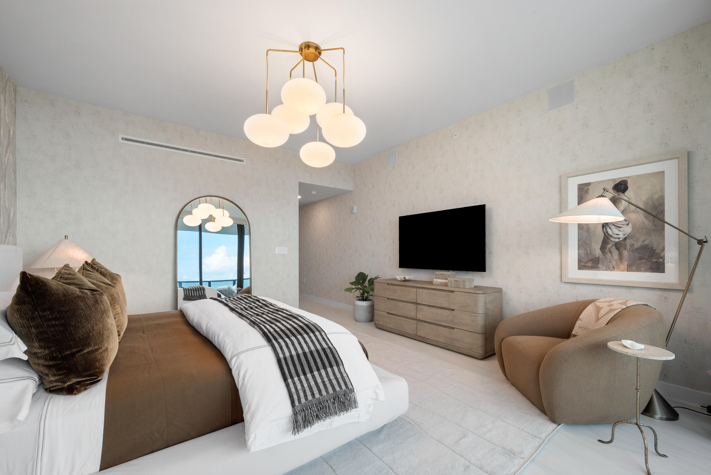 900 North Ocean Boulevard, Unit MPH02 Pompano Beach, FL 33062 - Photo 27 of 36 a bedroom with a bed and a flat screen tv