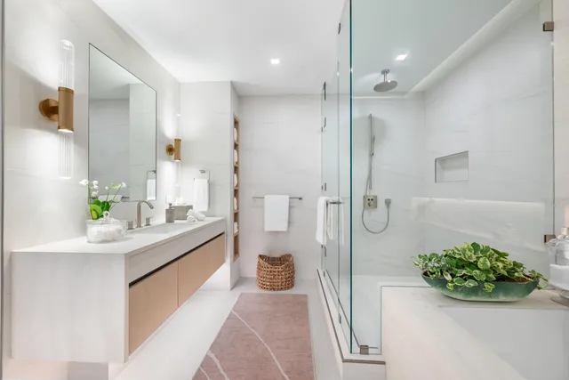 a bathroom with a sink and shower