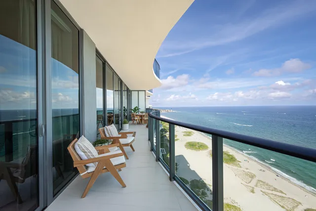 a balcony view with a potted plant