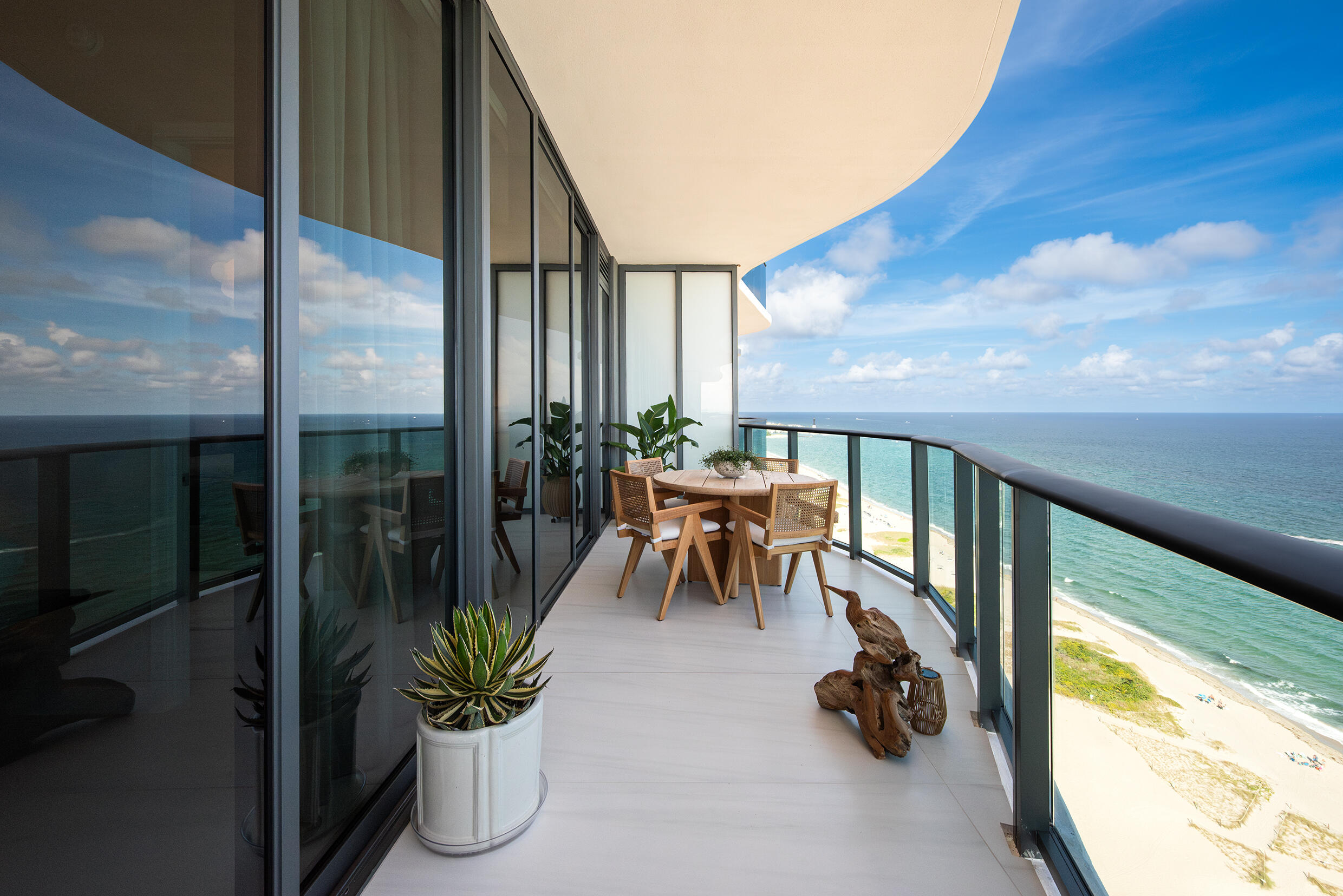 900 North Ocean Boulevard, Unit MPH02 Pompano Beach, FL 33062 - Photo 35 of 36 a view of a porch with furniture and garden