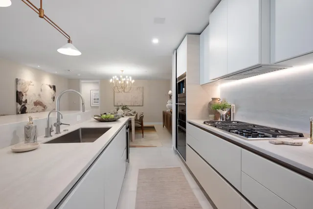 a kitchen with counter top space and cabinets