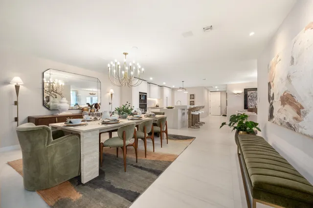 a living room with lots of furniture and a chandelier