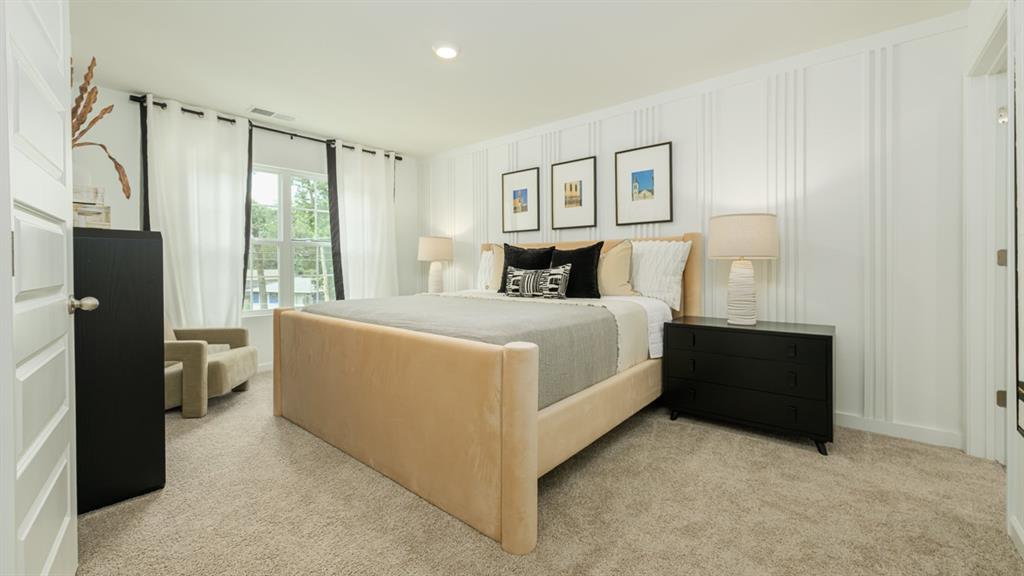 2836 Georgia Aster Way Northwest Atlanta, GA 30341 - Photo 15 of 28 a bed room with a bed and a night stand