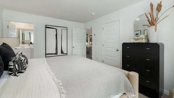a bathroom with a shower sink vanity mirror and toilet