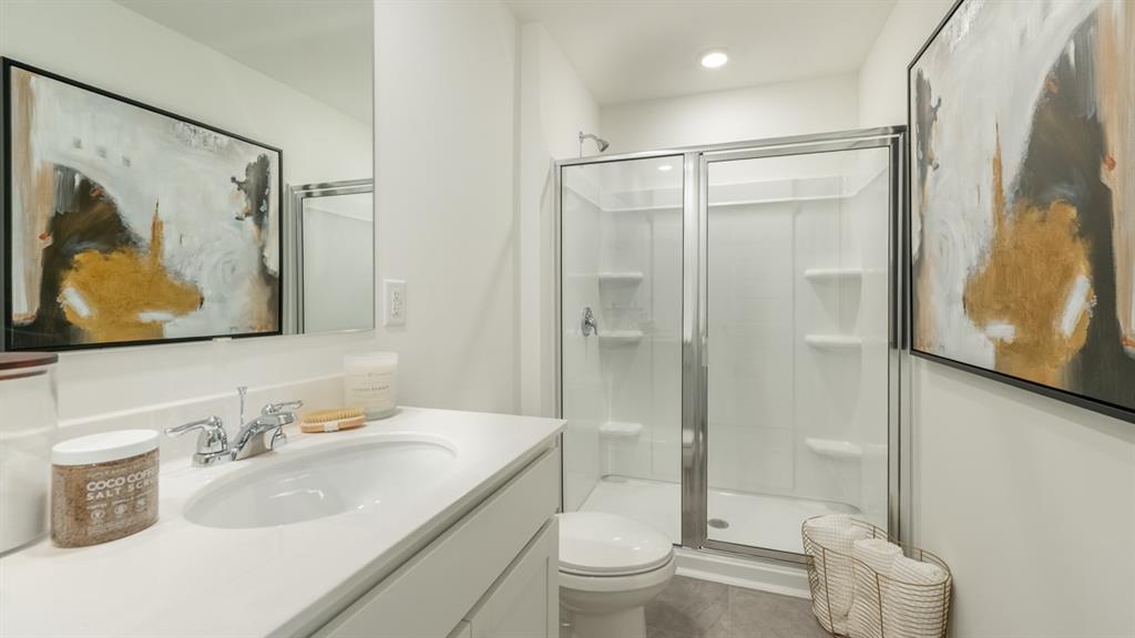 2836 Georgia Aster Way Northwest Atlanta, GA 30341 - Photo 19 of 28 a bathroom with a sink toilet and shower