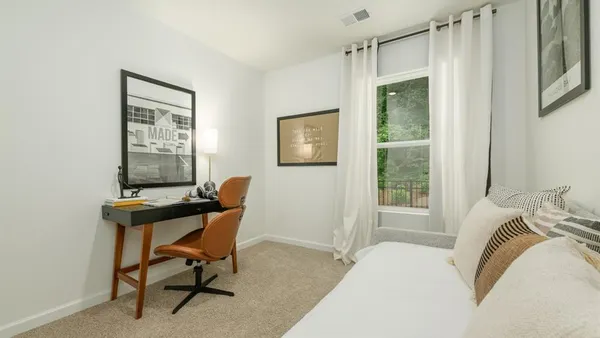 a bedroom with a bed and furniture