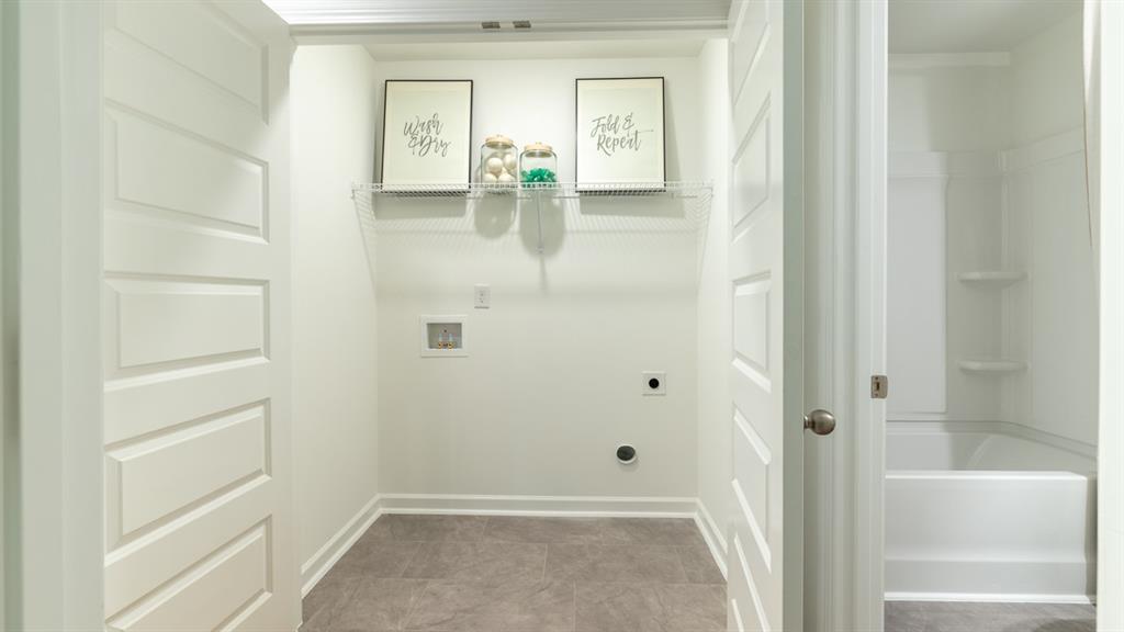 2836 Georgia Aster Way Northwest Atlanta, GA 30341 - Photo 28 of 28 a bathroom with a glass shower door
