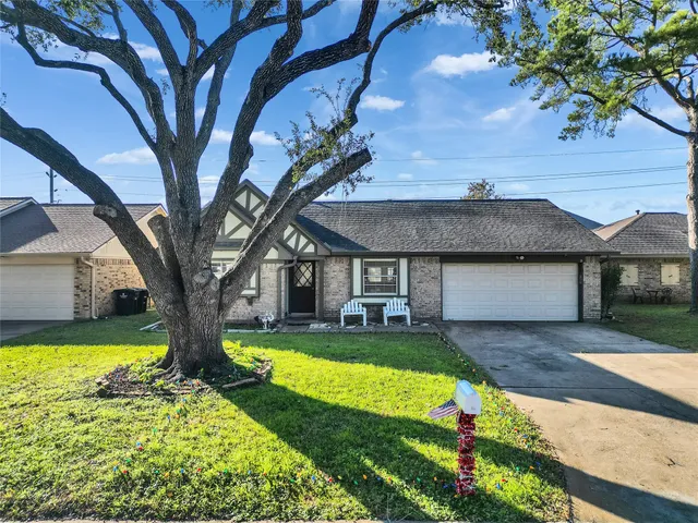 a front view of a house with swimming pool yard and patio