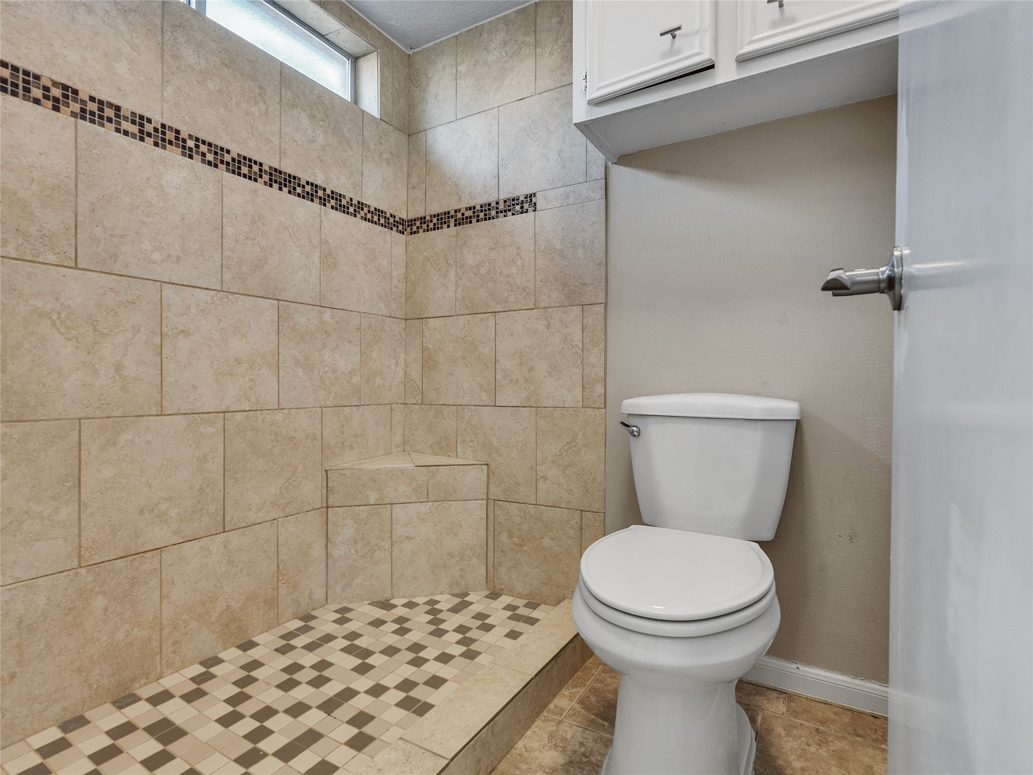 2201 Georgetown Street Katy, TX 77493 - Photo 14 of 20 a bathroom with a toilet and a shower