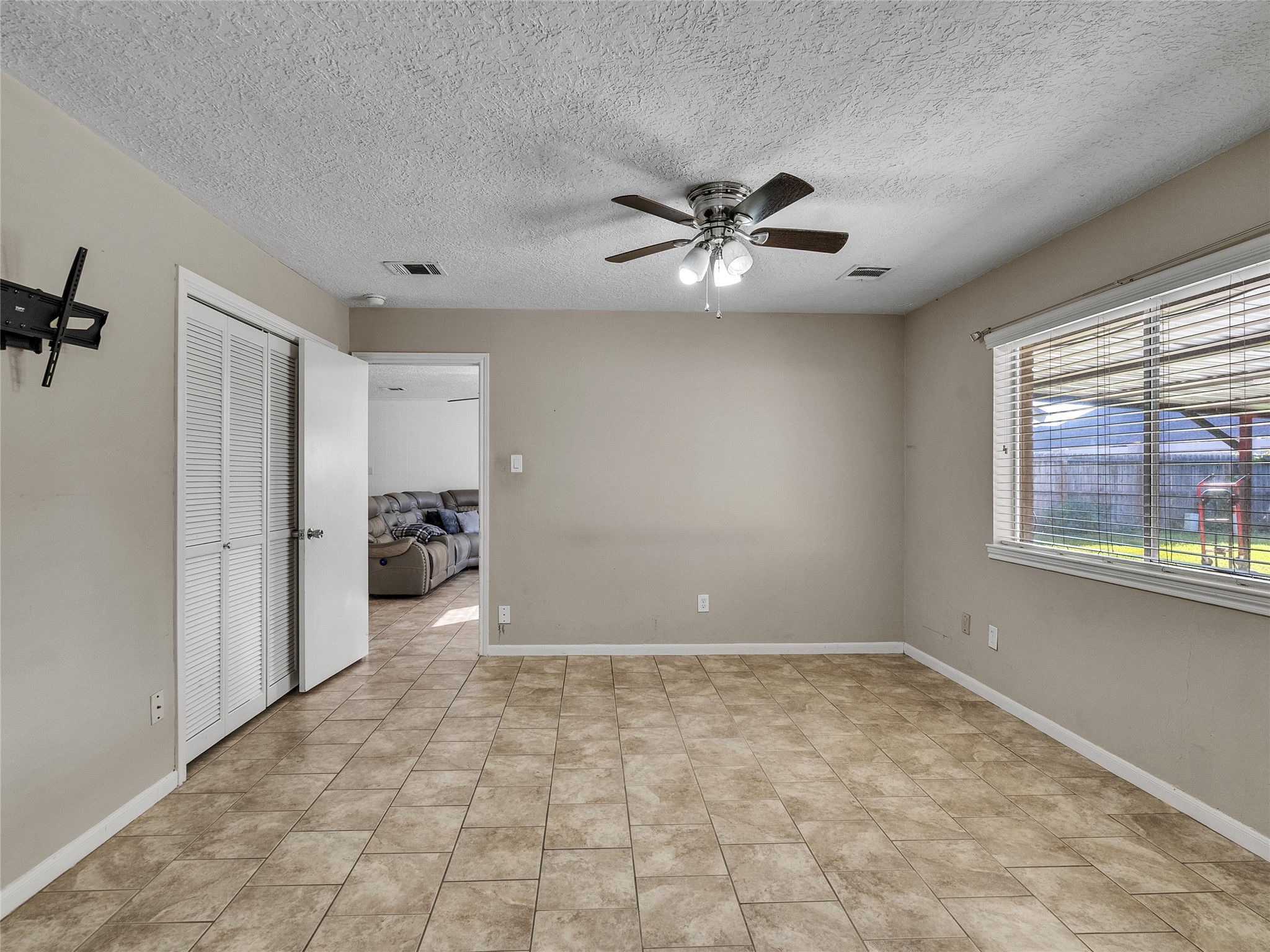 2201 Georgetown Street Katy, TX 77493 - Photo 15 of 20 a view of an empty room with a window